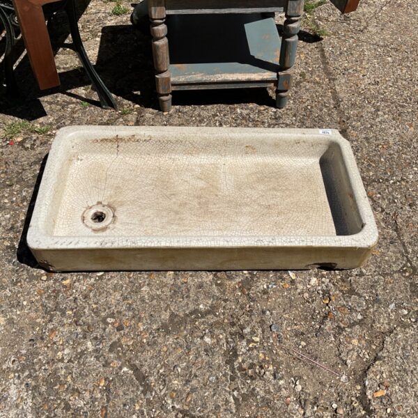 Vintage ceramic garden sink with crazed glaze, ideal for outdoor use.