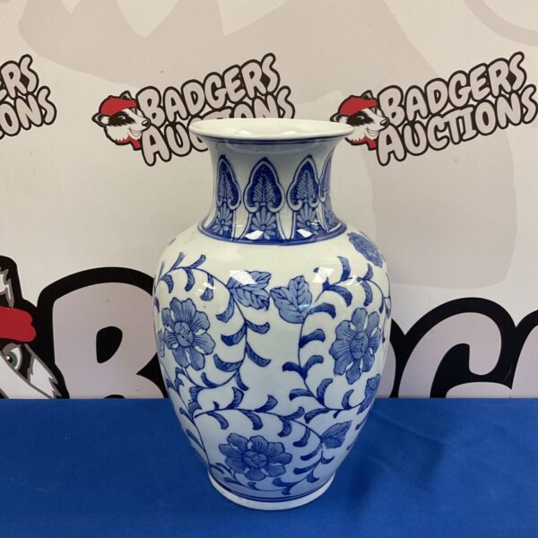 Chinese blue and white porcelain vase with floral vine design.