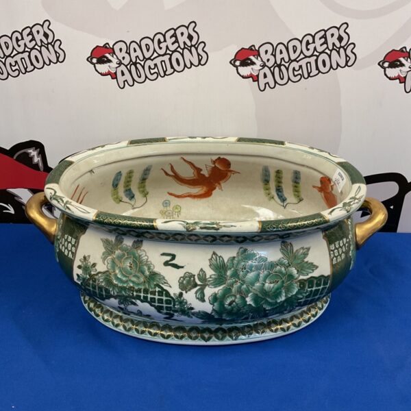 Vintage Chinese porcelain fish bowl with goldfish design.
