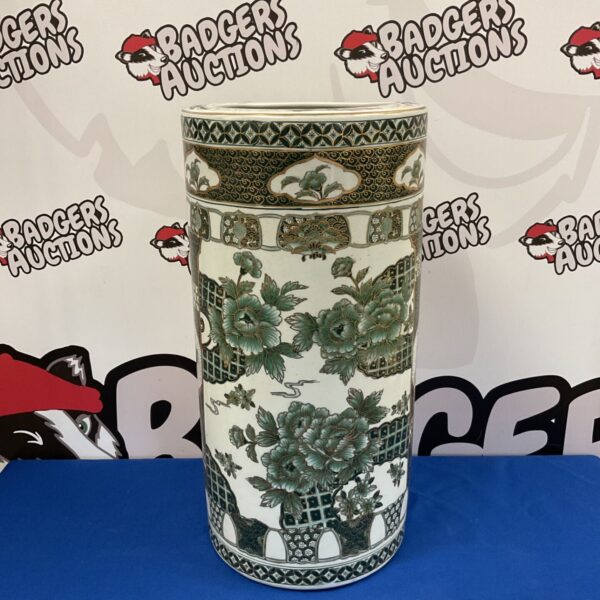 Vintage Chinese porcelain stick stand with green and gold foliage.