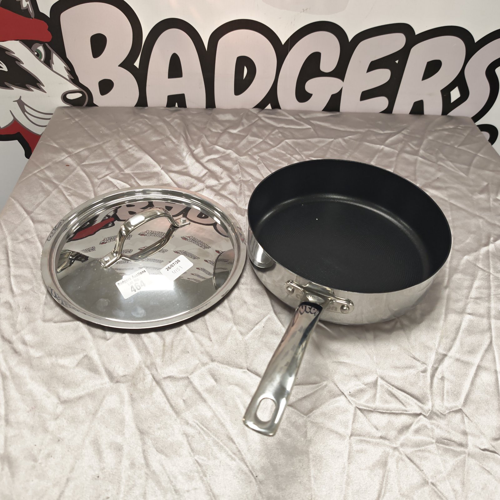 Stainless steel Circulon frying pan with glass lid.