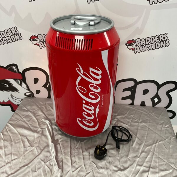 Red Coca Cola mini fridge, collectible retro appliance.