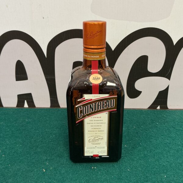 Vintage Cointreau liqueur bottle with original label.