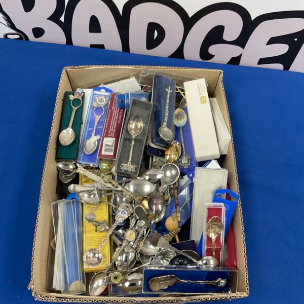 Large lot of vintage collector tea spoons with varied designs.