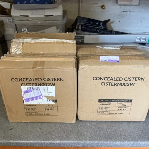 Stack of four concealed cisterns in original packaging.