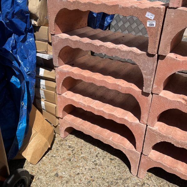 Five concrete wine storage units stacked for cellar storage.
