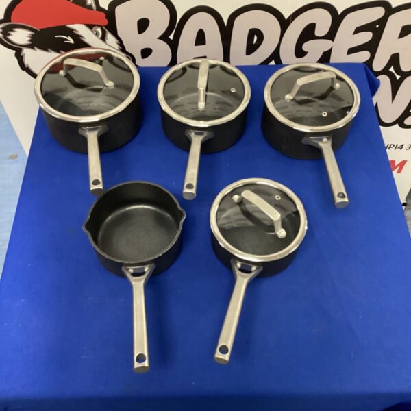 Stainless steel cooking pans set with four lids, kitchenware.