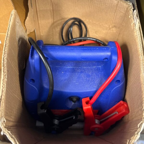 Coopers of Stortford 8980 car jump starter with red and black leads.