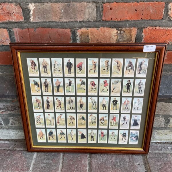 Framed set of vintage Cope Bros golf cigarette cards against a brick wall.