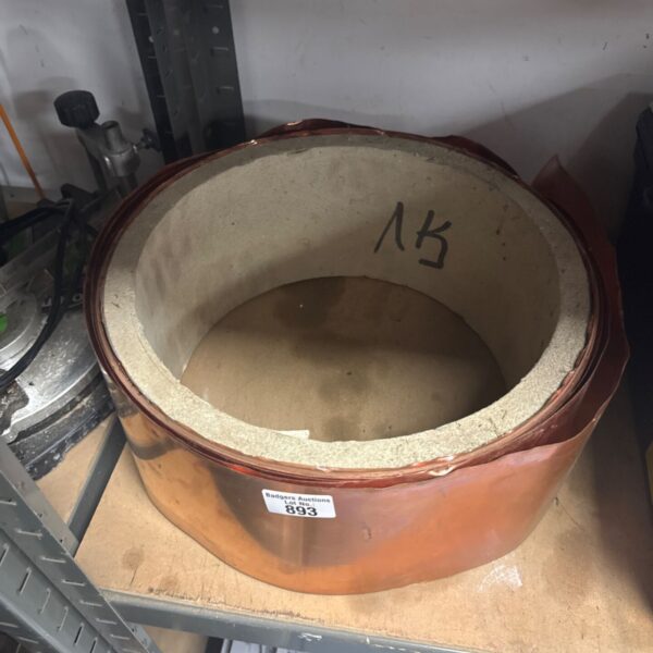 Part used roll of copper flashing with a natural patina.