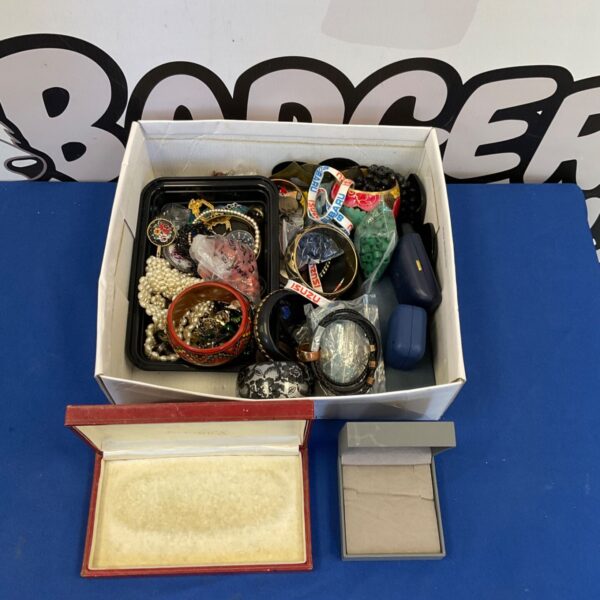 Costume jewellery lot with empty display cases for vintage accessories.