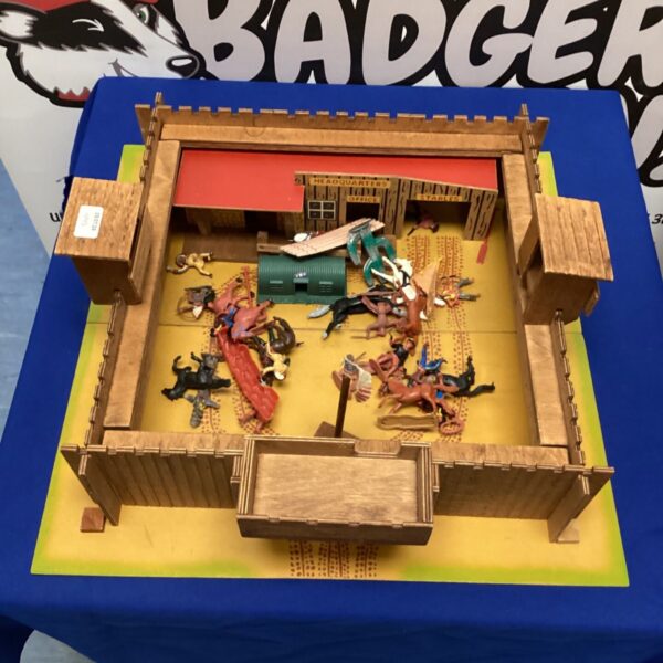 Vintage Cowboys and Indians playset with a detailed fort structure.