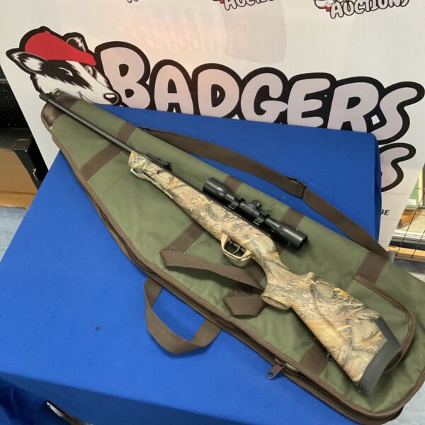 Crosman Stealth Shot air rifle with scope in camo finish.
