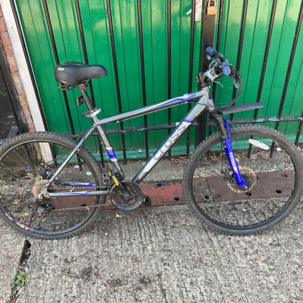 Silver and black Cross FXT500 mountain bike with blue accents.