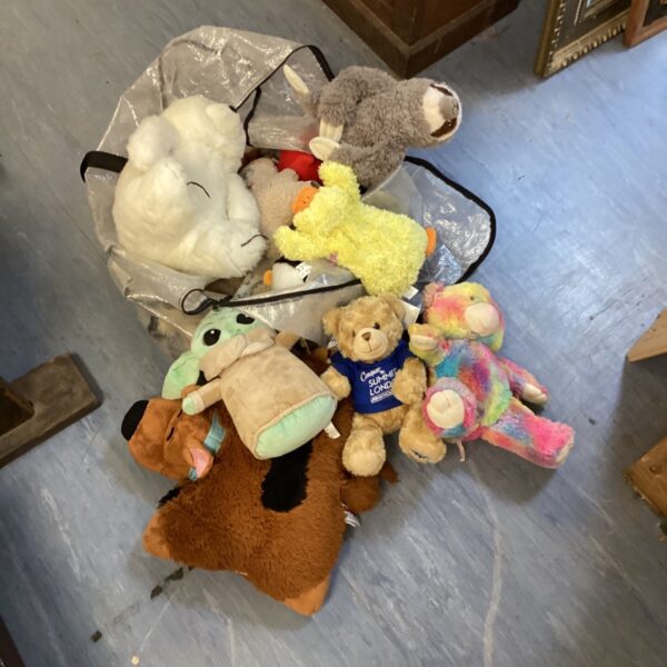 Large bundle of assorted cuddly toys including Baby Yoda and Scooby Doo.