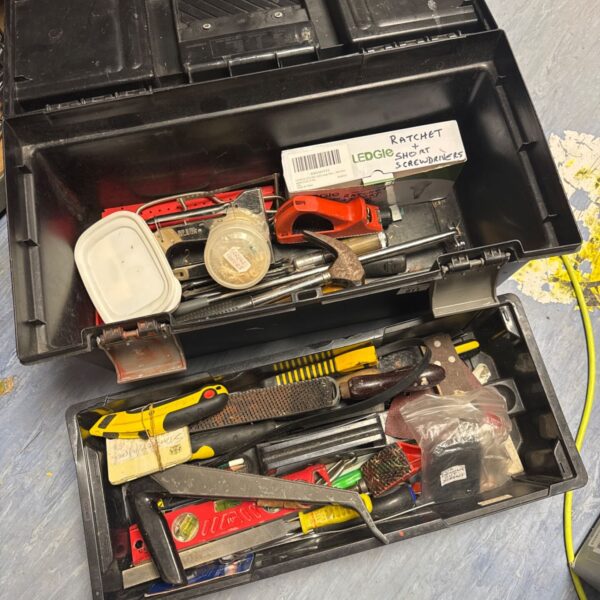 Curver toolbox filled with assorted hand tools for DIY projects.