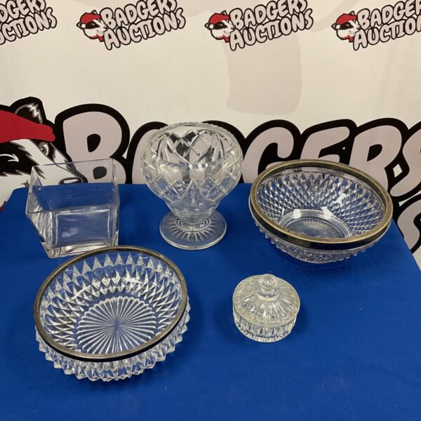 Lot of five vintage cut glass and crystal bowls with silver rims.