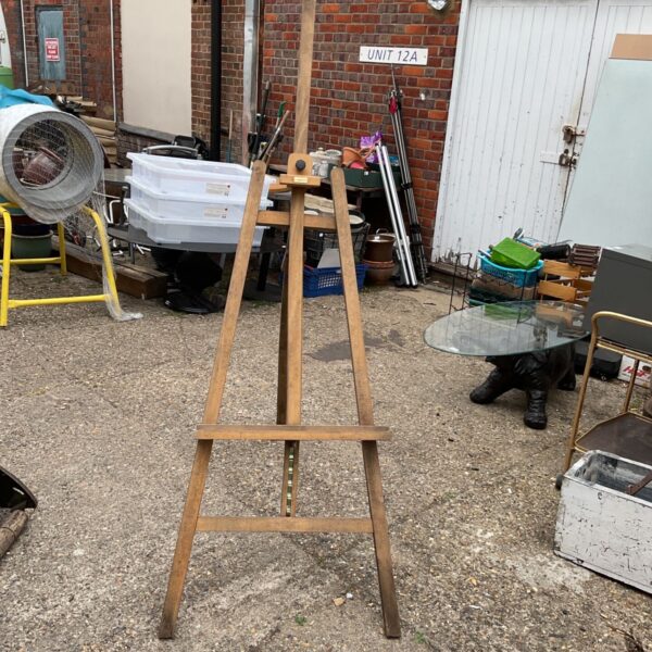 Vintage Daler Rowney wooden easel in a garden setting.