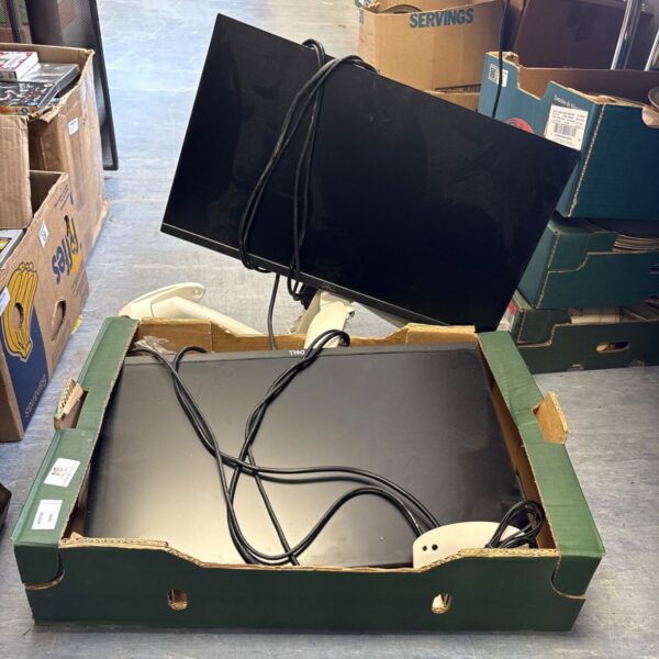 Two used Dell monitors with cables for computer setup.