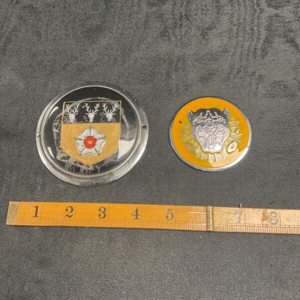 Vintage Derbyshire and Jaguar car badges for collectors.