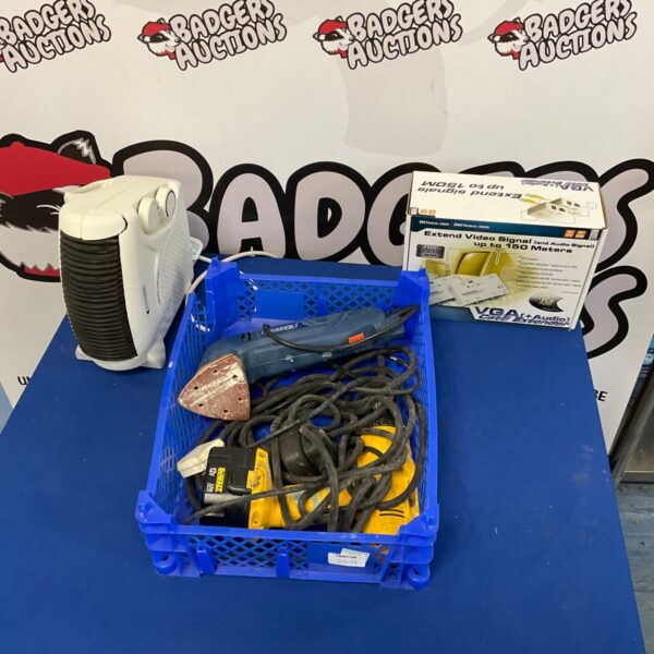 Dewalt drill in a tray of mixed tools and hardware.