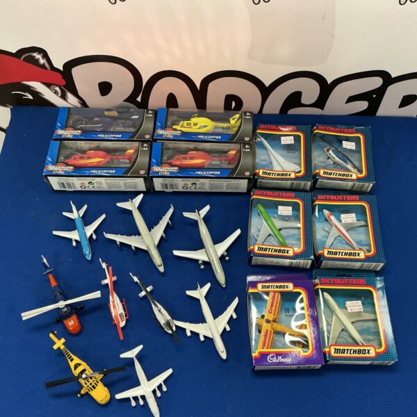 Diecast aircraft models including Matchbox SkyBusters and Teamsterz helicopters.