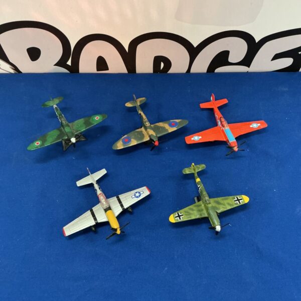 Diecast model planes lot including Spitfire and Messerschmitt aircraft.