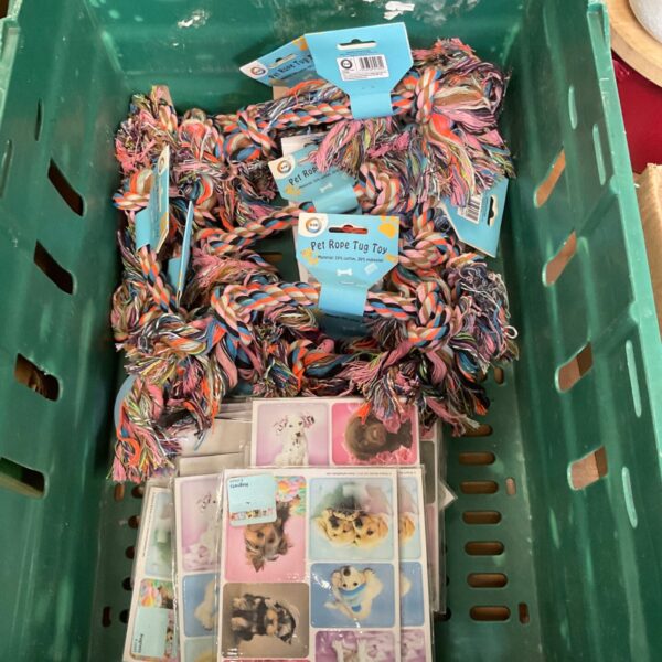 Close-up of dog tug rope toys and sticker sheets.