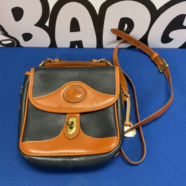 Vintage Dooney & Bourke All Weather Leather satchel in brown and tan.