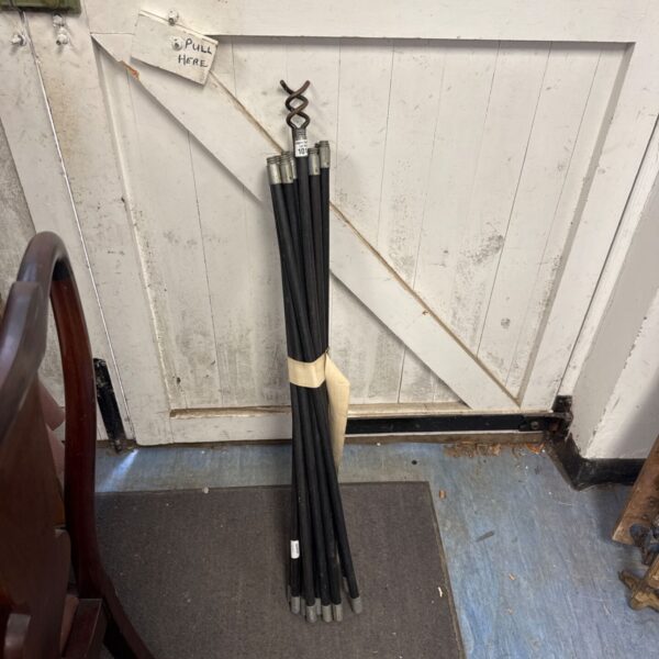 Set of used drain rods for clearing blocked drains.