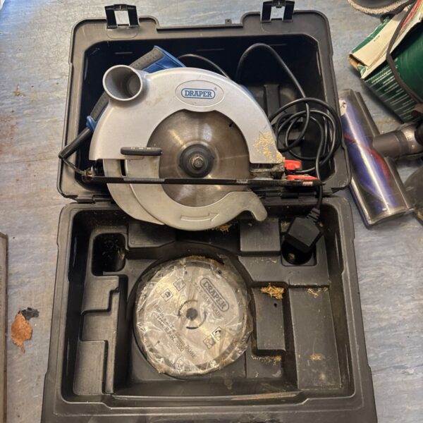 Draper circular saw with spare blade in open case.