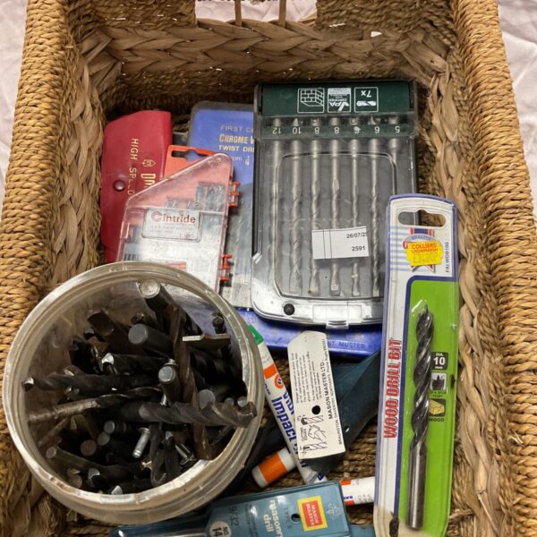 Assorted drill bit set in original packaging, including wood, steel, and masonry bits.