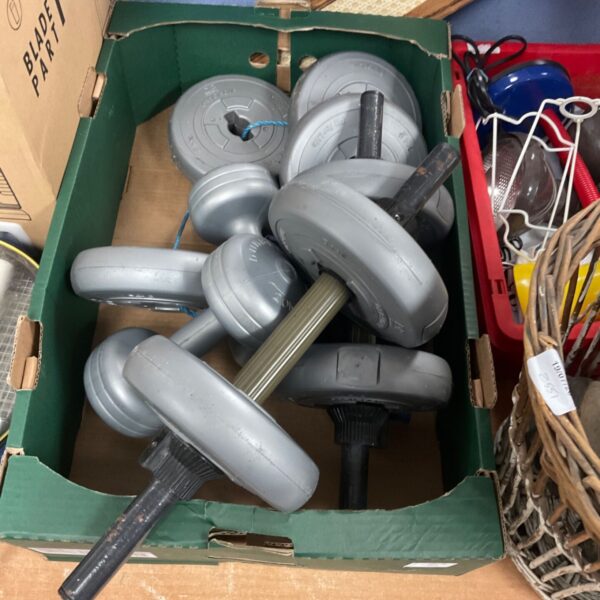 Grey rubber dumbbell set for home fitness and exercise.