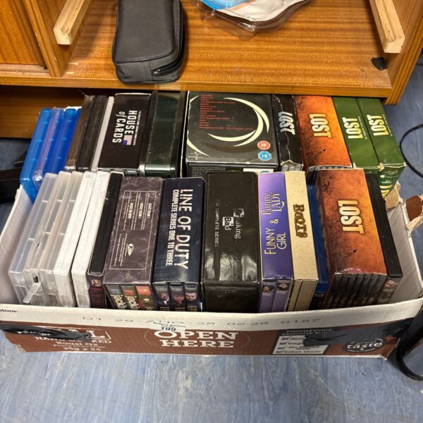 Mixed lot of DVDs and Blu-ray discs, including box sets.