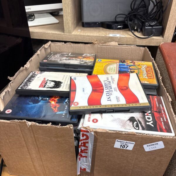 Box of assorted DVDs for home entertainment.