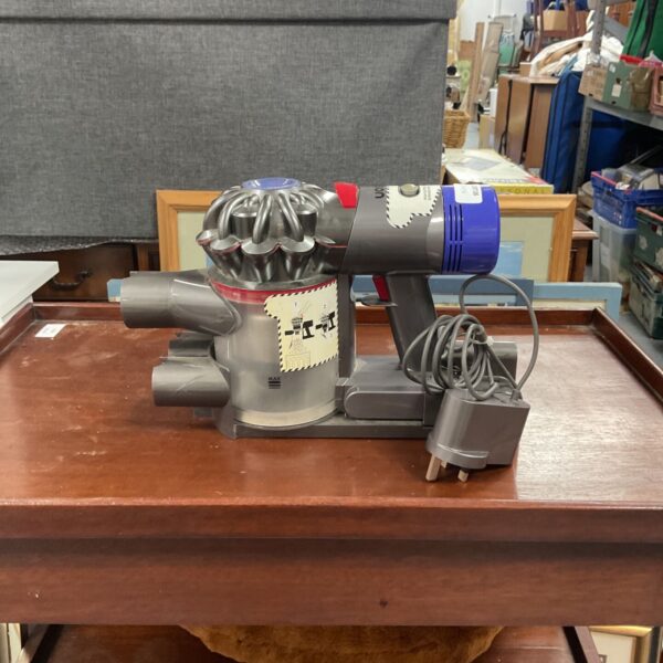 Dyson V8 vacuum cleaner motor for parts or repair.