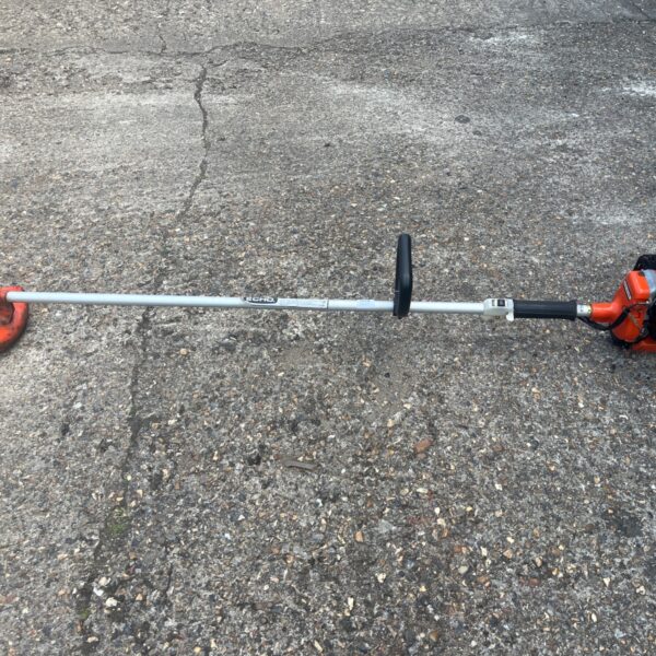 Used Echo petrol strimmer with curved shaft and engine housing.