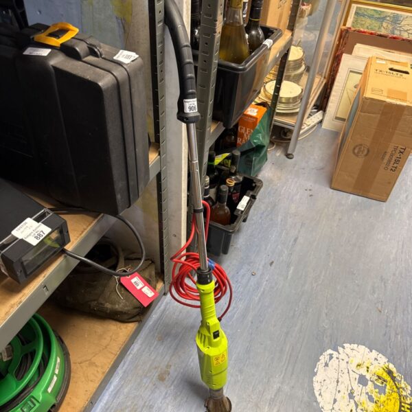 Yellow and black electric weed burning lance for garden use.