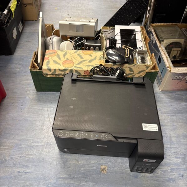 Mixed lot of electrical items including camera and Amazon Echo.