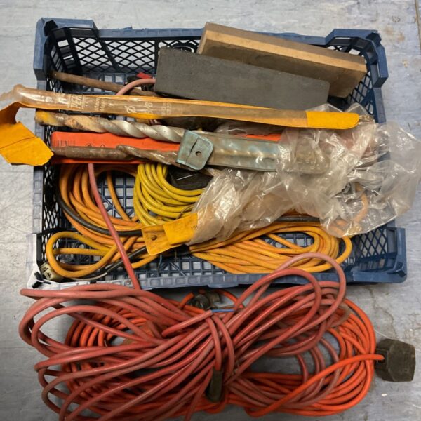 Orange extension cable with masonry drills and oil stones.