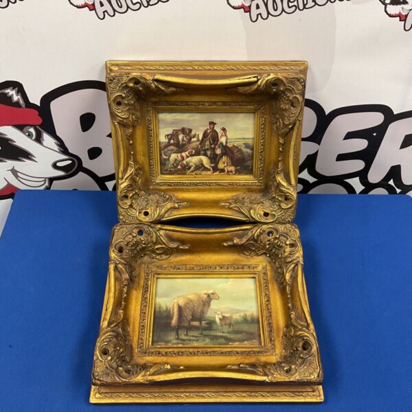 Vintage farm scene prints in ornate gilded frames, depicting sheep.