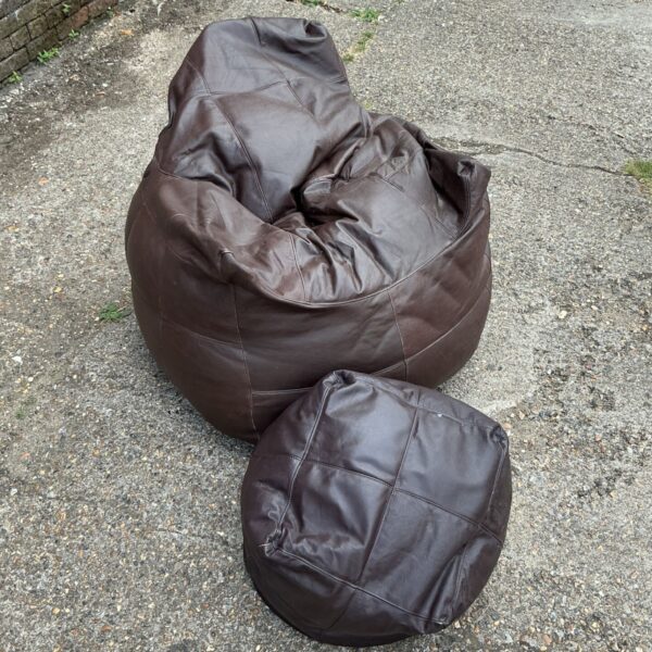 Brown faux leather bean bag chair with footrest.