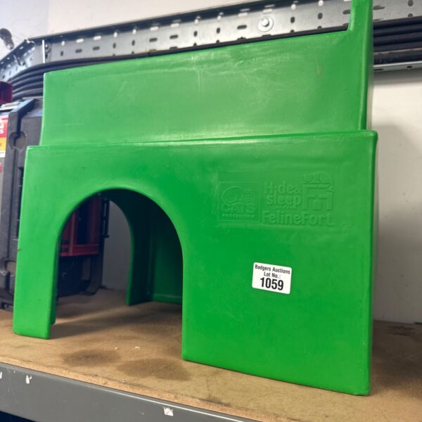 Green Felinefort Hide & Sleep cat shelter for indoor use.