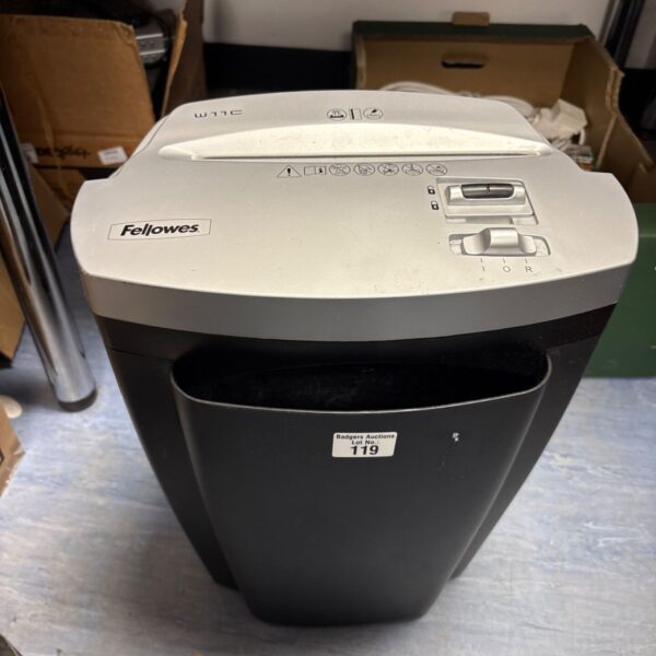 Close-up of a Fellowes paper shredder in used condition.