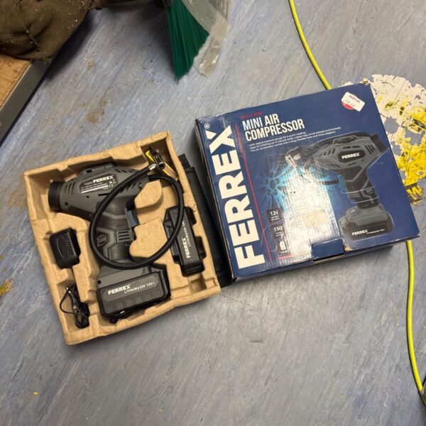 Ferrex cordless tyre inflator in original packaging.
