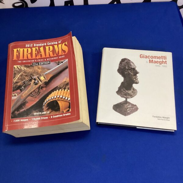 Firearms catalog and sculpture book lot for collectors.