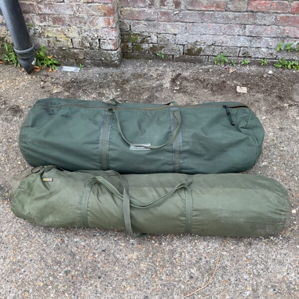 Pair of green fishing chair covers for angling shelter.