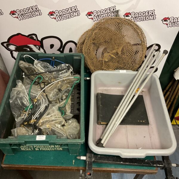New fishing rod rests and tackle box in a mixed lot.