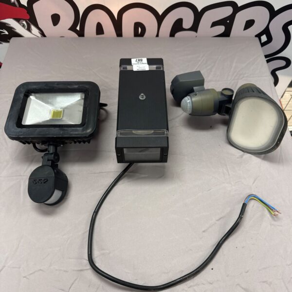 Assorted flood lights including Auraglow, for outdoor garden lighting.