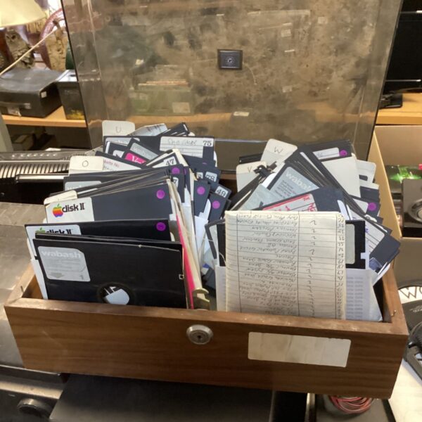 Collection of vintage 3.5 inch floppy disks for data storage.